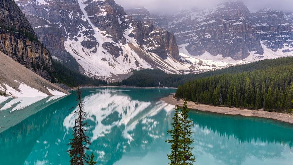 Turquoise Moraine Lake surrounded by mountains in Banff National Park, a top nature destination in May