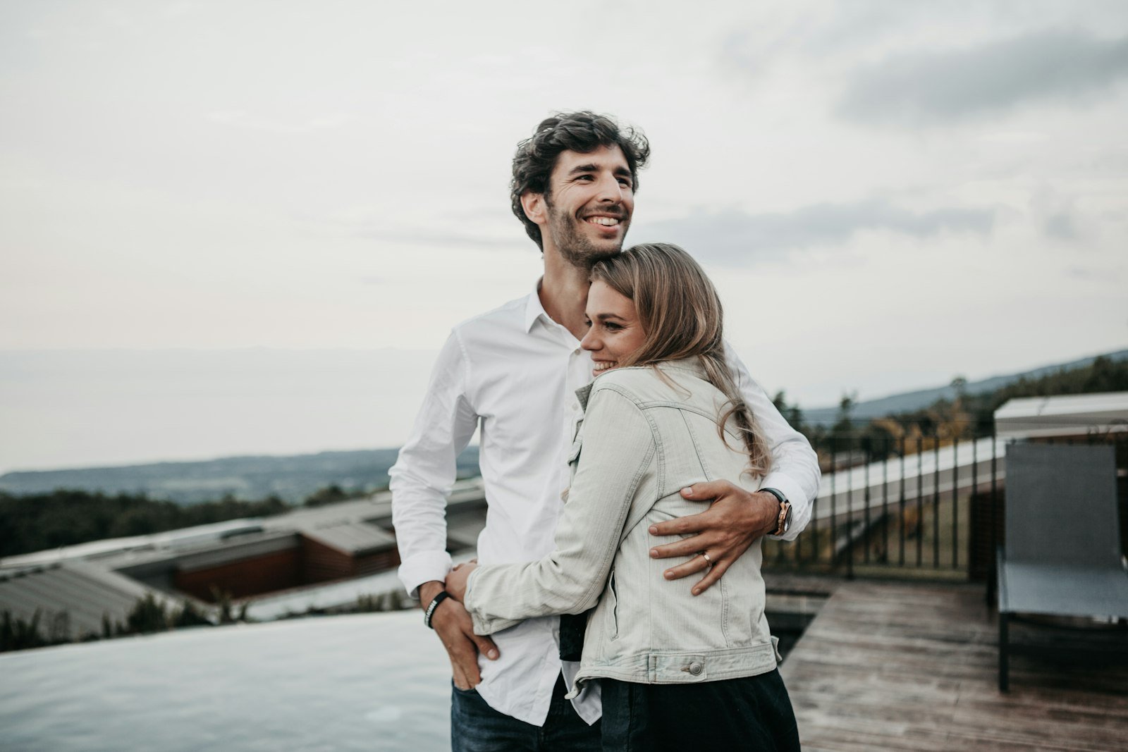 Newlywed couple embracing during their honeymoon trip