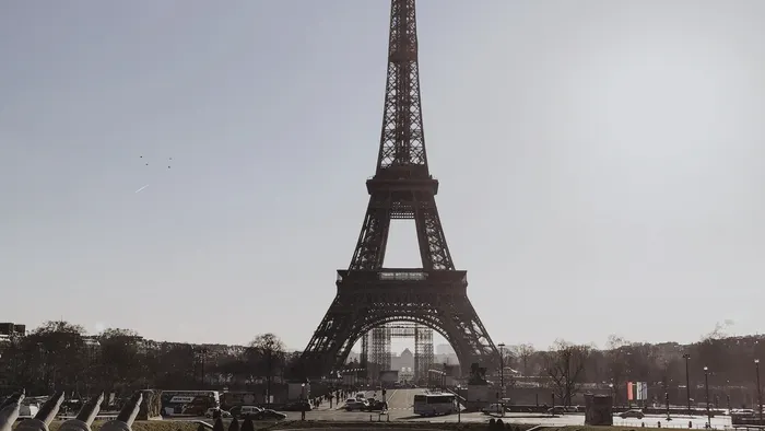 Eiffel Tower in Paris framed by fountains under a clear sky