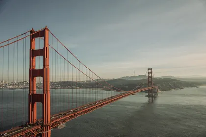 Golden Gate Bridge with the San Francisco skyline in the backdrop before sunset