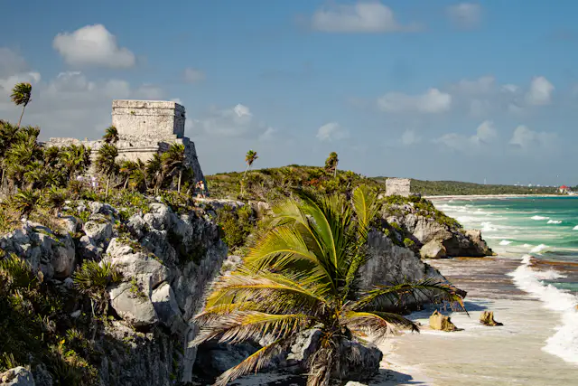Tulum Mayan ruins overlooking clear turquoise Caribbean water during dry season