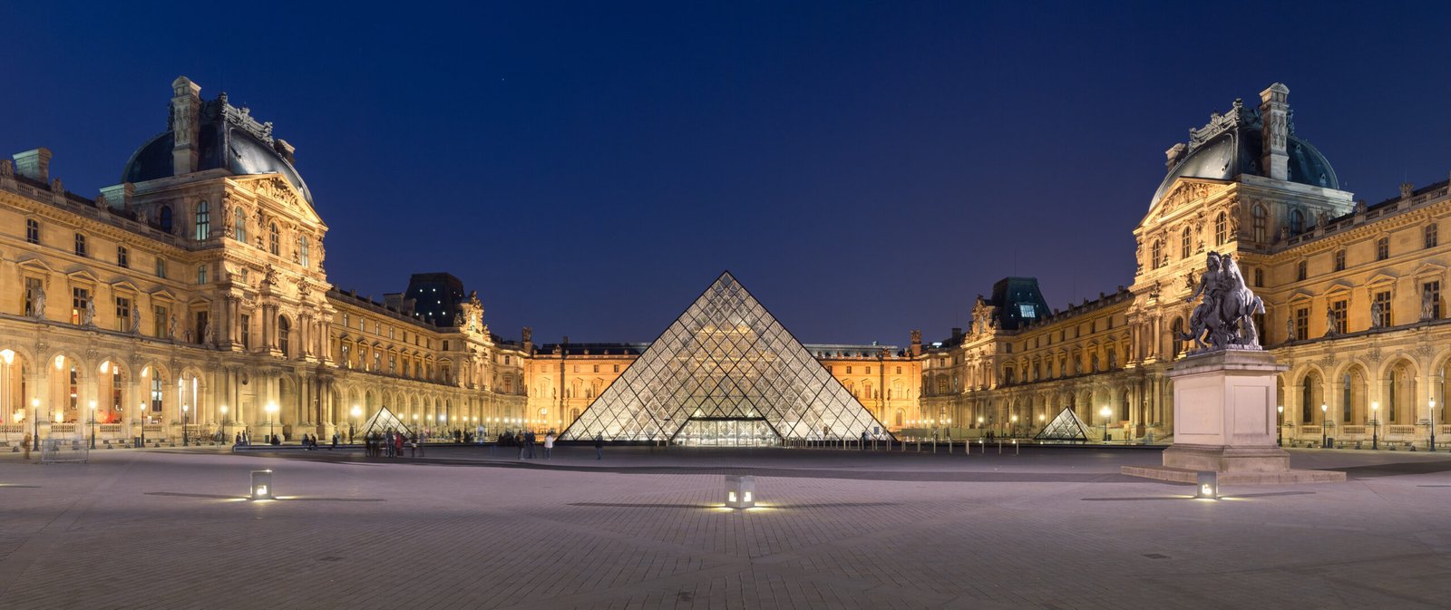 The Louvre Museum and glass pyramid in the 1st arrondissement of Paris