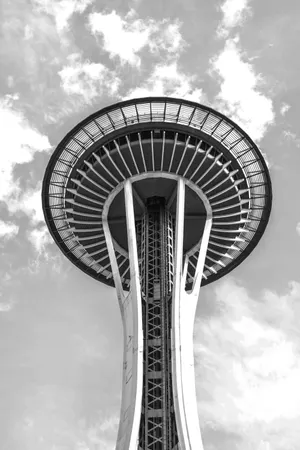Seattle's Space Needle captured from a low angle against a cloudy sky
